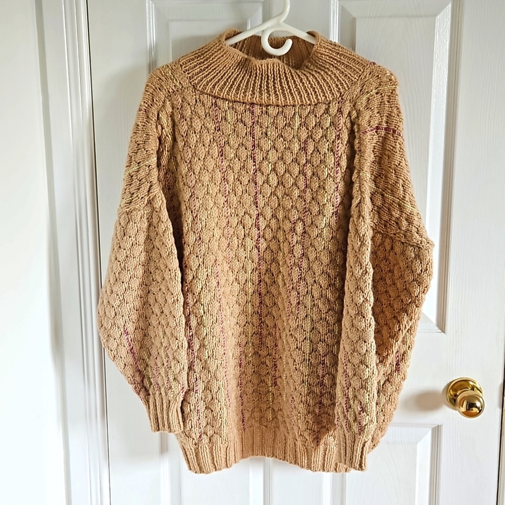 Hand knit sweater with colorful stitching